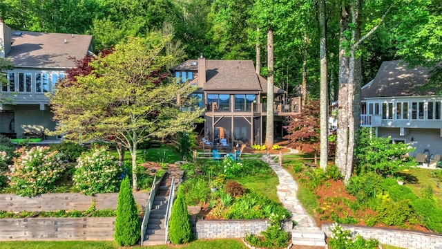 35 Toxaway Landing Dr, Lake Toxaway, NC 28747 - back of property with stairs and a wooden deck