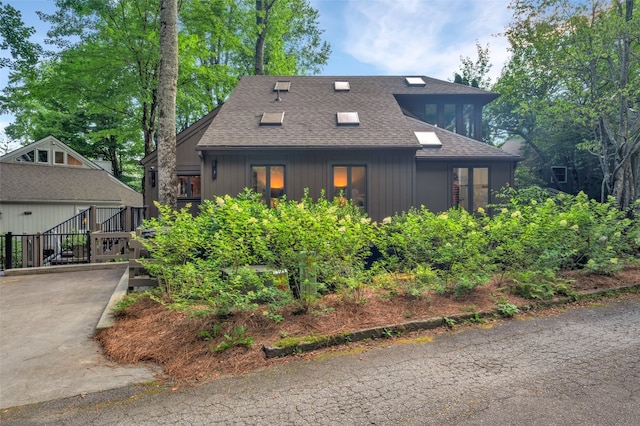 35 Toxaway Landing Dr, Lake Toxaway, NC 28747 - view of front facade with roof with shingles and driveway