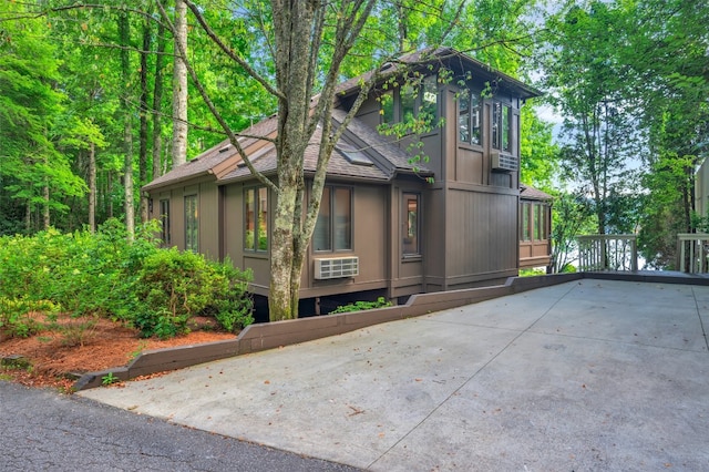 35 Toxaway Landing Dr, Lake Toxaway, NC 28747 - view of side of home with roof with shingles and driveway