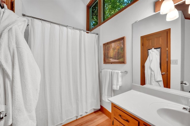 35 Toxaway Landing Dr, Lake Toxaway, NC 28747 - full bathroom with vanity, wood finished floors, and a shower with curtain