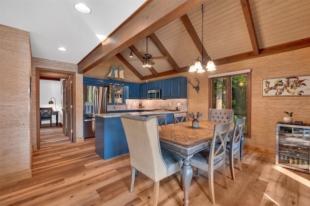 35 Toxaway Landing Dr, Lake Toxaway, NC 28747 - dining area with beverage cooler, light wood finished floors, a chandelier, beamed ceiling, and recessed lighting