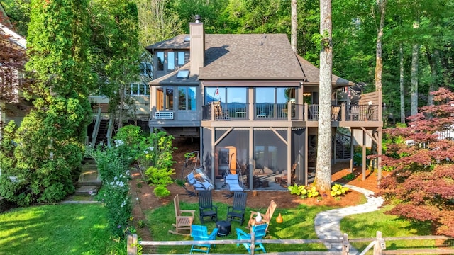 35 Toxaway Landing Dr, Lake Toxaway, NC 28747 - rear view of house featuring stairway, a wooden deck, a sunroom, roof with shingles, and a chimney