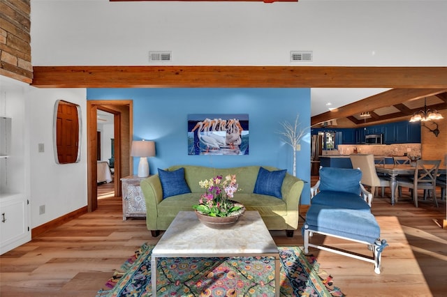 35 Toxaway Landing Dr, Lake Toxaway, NC 28747 - living room featuring light wood finished floors, beamed ceiling, and a chandelier