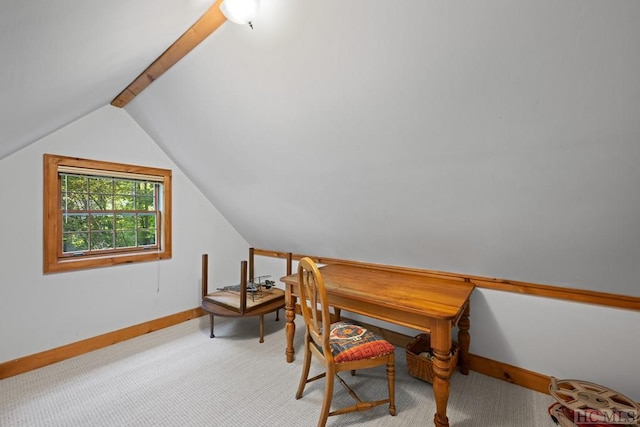 office space with lofted ceiling and carpet