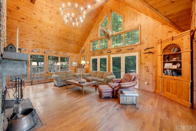 living room featuring an inviting chandelier, wood ceiling, high vaulted ceiling, and light hardwood / wood-style floors