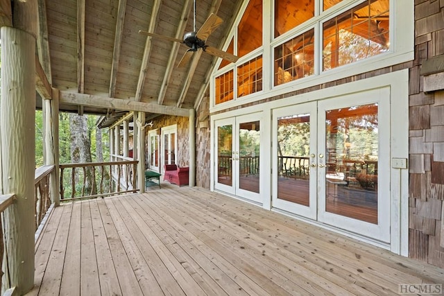 wooden terrace featuring french doors and ceiling fan