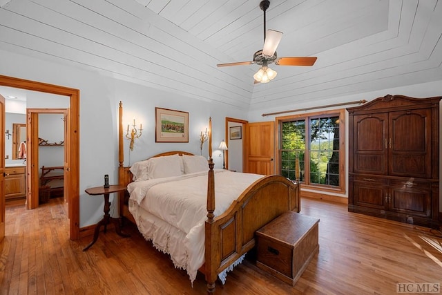 bedroom featuring vaulted ceiling, wooden ceiling, ceiling fan, and light hardwood / wood-style flooring