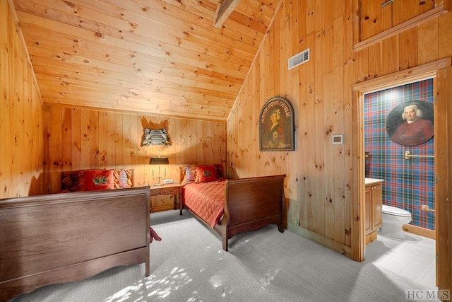 bedroom featuring wood ceiling, lofted ceiling, ensuite bathroom, and light carpet