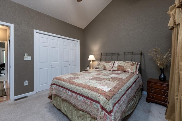 60 Pine Cone Ct, Sapphire, NC 28774 - carpeted bedroom featuring vaulted ceiling, a closet, baseboards, a ceiling fan, and a textured wall