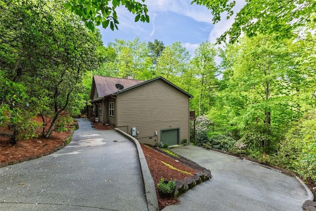 60 Pine Cone Ct, Sapphire, NC 28774 - view of side of home with driveway and an attached garage