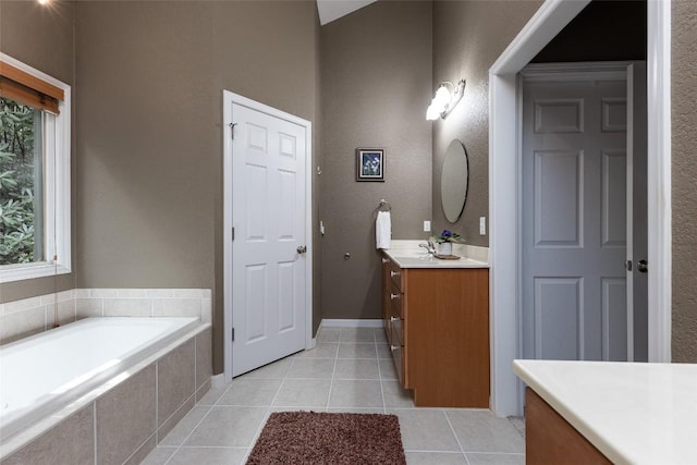 60 Pine Cone Ct, Sapphire, NC 28774 - bathroom featuring vanity, a bath, and tile patterned flooring