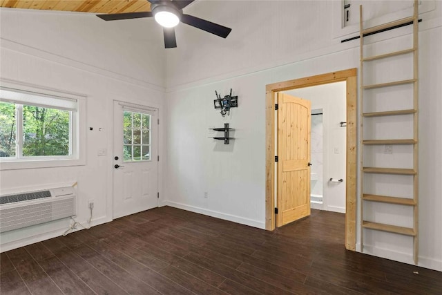 entryway featuring a ceiling fan, dark wood finished floors, an AC wall unit, and baseboards