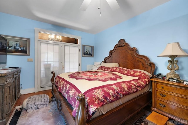 bedroom featuring ceiling fan and dark hardwood / wood-style floors