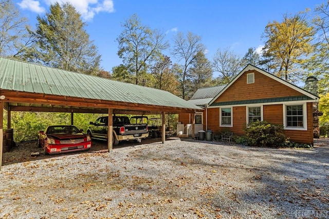 view of parking / parking lot featuring a carport