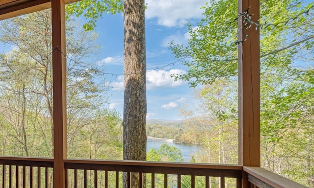 wooden deck with a water view
