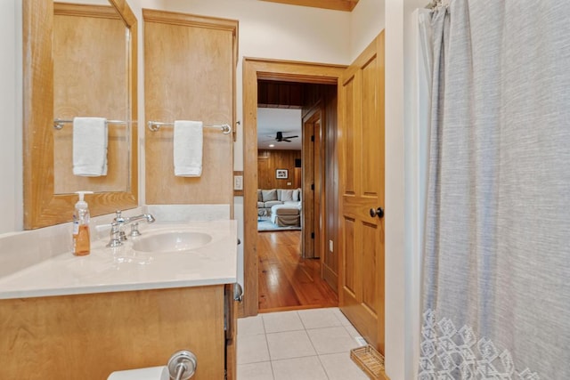 bathroom featuring tile patterned flooring and vanity