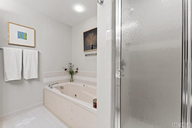 bathroom featuring tile patterned floors and independent shower and bath