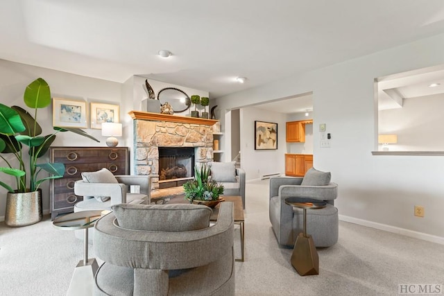 carpeted living room featuring a stone fireplace