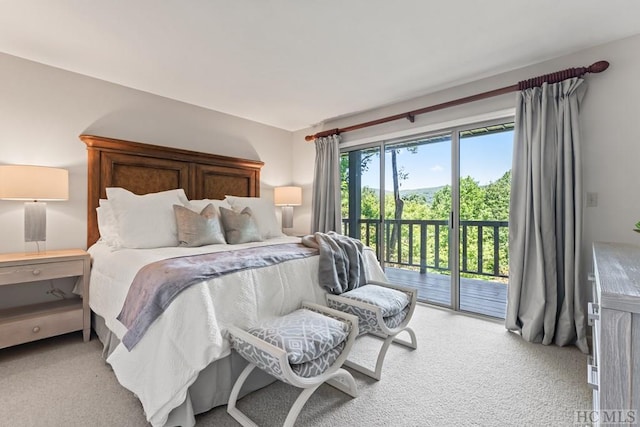 bedroom featuring light carpet and access to outside