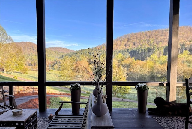deck featuring a wooded view