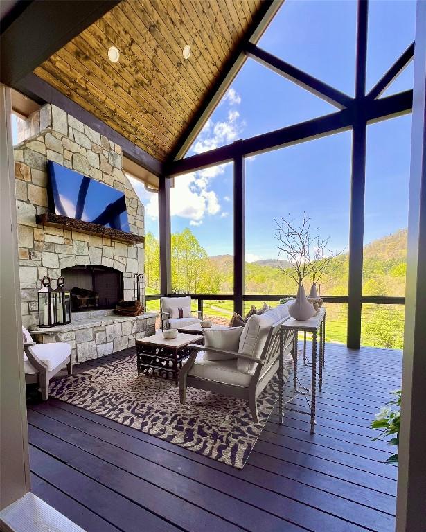 207 Comanche Rd, Cullowhee, NC 28723 - wooden terrace with an outdoor living space with a fireplace