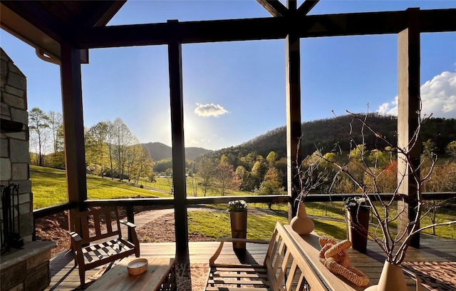 sunroom / solarium with a mountain view