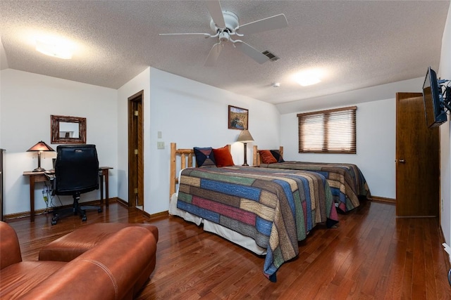 116 Fairway Villas Dr Unit D, Sapphire, NC 28774 - bedroom featuring a textured ceiling, hardwood / wood-style floors, lofted ceiling, and ceiling fan