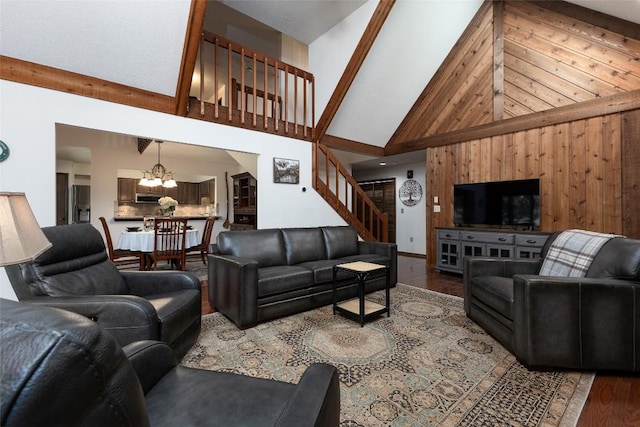 116 Fairway Villas Dr Unit D, Sapphire, NC 28774 - living room featuring high vaulted ceiling, wood finished floors, a chandelier, stairway, and wooden walls
