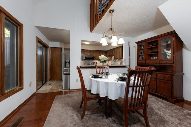 116 Fairway Villas Dr Unit D, Sapphire, NC 28774 - dining room with a chandelier and wood finished floors