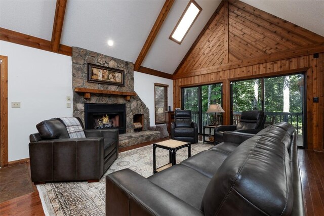 116 Fairway Villas Dr Unit D, Sapphire, NC 28774 - living room featuring wood finished floors, healthy amount of natural light, a fireplace, beamed ceiling, and high vaulted ceiling