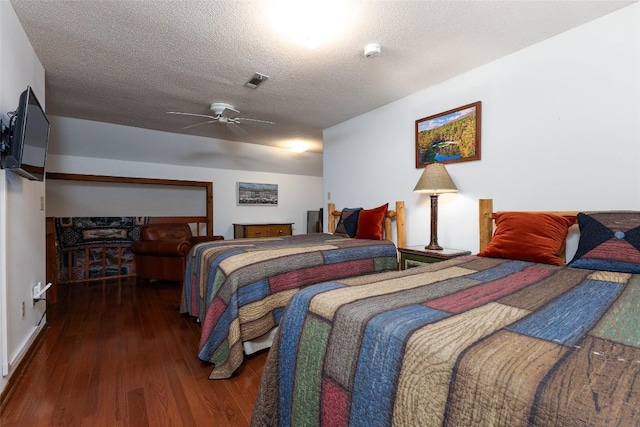 116 Fairway Villas Dr Unit D, Sapphire, NC 28774 - bedroom with wood finished floors, a textured ceiling, and ceiling fan