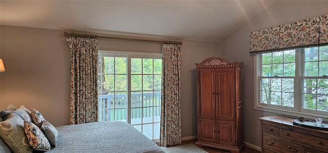 239 Island Point Rd, Lake Toxaway, NC 28747 - bedroom featuring multiple windows, access to exterior, baseboards, and vaulted ceiling