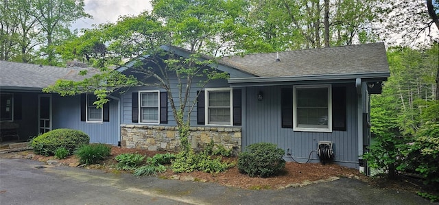 239 Island Point Rd, Lake Toxaway, NC 28747 - view of home's exterior featuring stone siding and roof with shingles