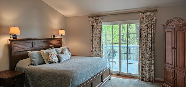 239 Island Point Rd, Lake Toxaway, NC 28747 - bedroom featuring access to outside, vaulted ceiling, baseboards, and wood finished floors