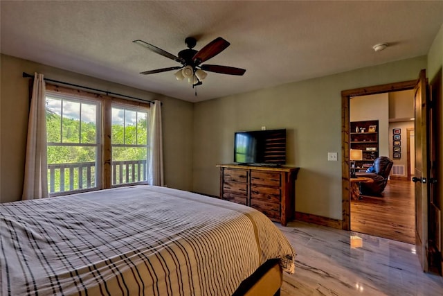 bedroom with ceiling fan, baseboards, visible vents, and wood finished floors