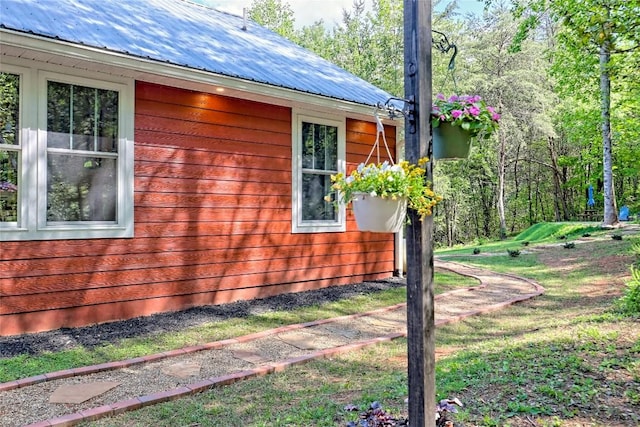 view of home's exterior with metal roof