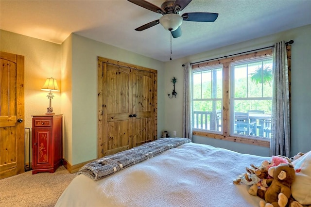 bedroom featuring carpet floors, ceiling fan, and baseboards