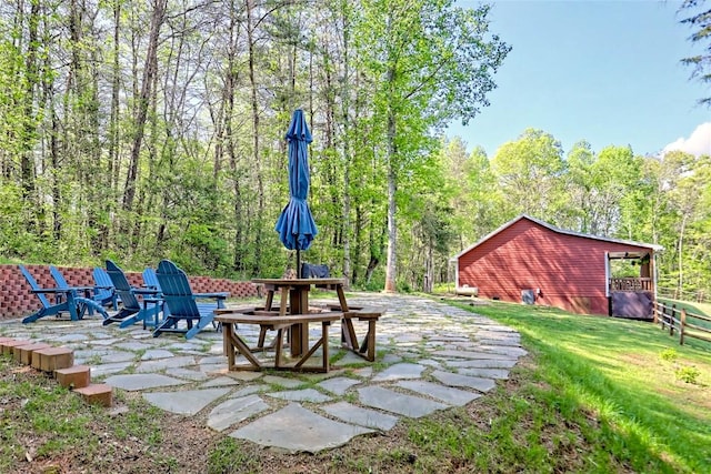 view of yard with a patio and an outdoor fire pit