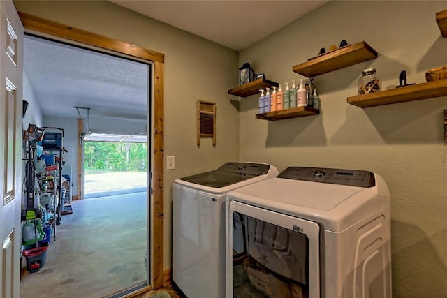 laundry room featuring separate washer and dryer and laundry area