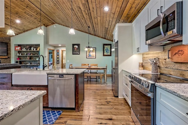 kitchen with white cabinets, wooden ceiling, a sink, light wood-style flooring, and stainless steel appliances