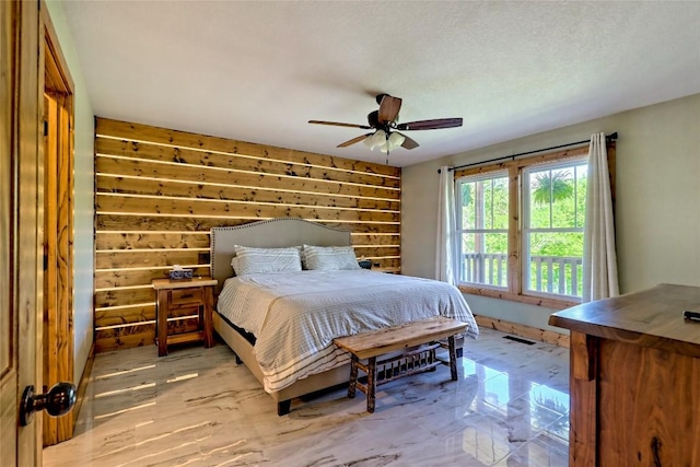bedroom with visible vents and a ceiling fan