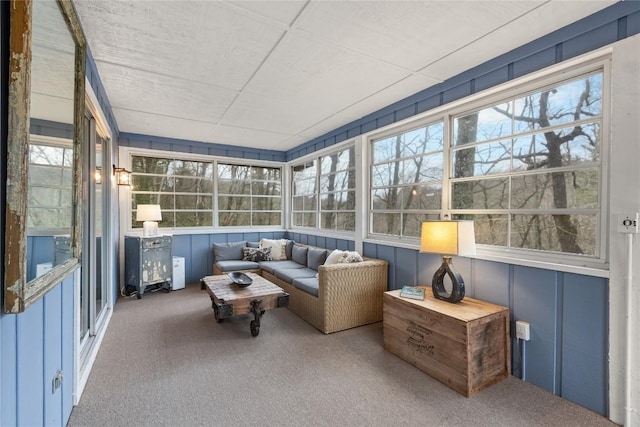 sunroom featuring an outdoor hangout area