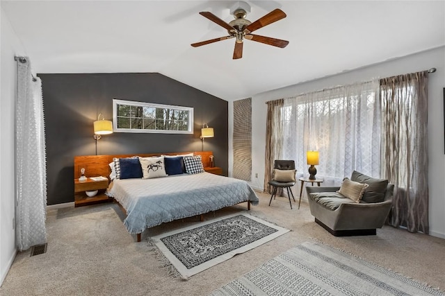 carpeted bedroom with visible vents, baseboards, a ceiling fan, and lofted ceiling