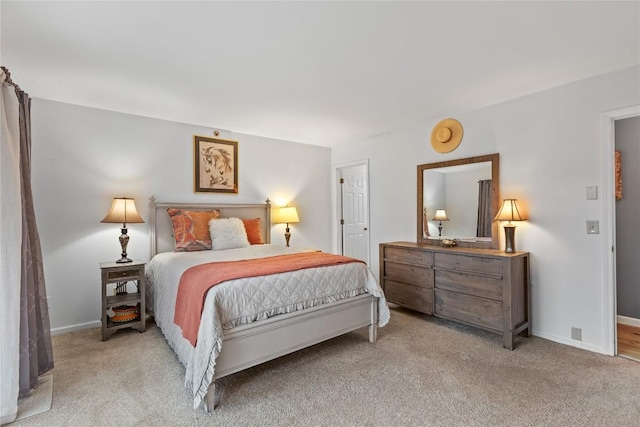 carpeted bedroom featuring baseboards