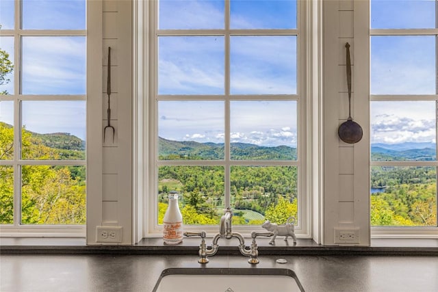 168 Old Wagon Rd, Highlands, NC 28741 - kitchen view of a sink, a mountainous background, and dark countertops
