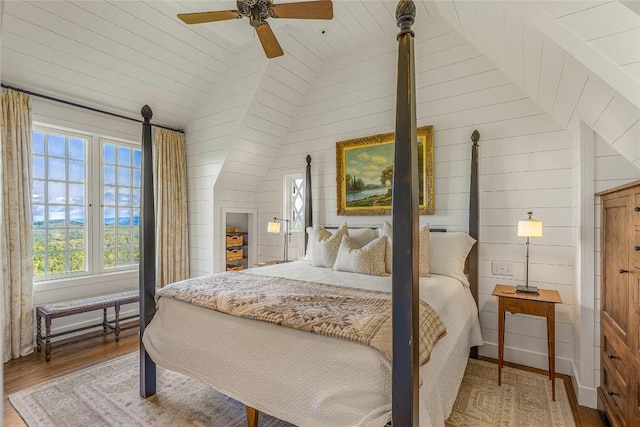 168 Old Wagon Rd, Highlands, NC 28741 - bedroom featuring lofted ceiling, multiple windows, wood finished floors, wooden walls, and wood ceiling