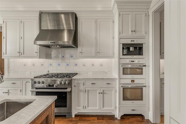 168 Old Wagon Rd, Highlands, NC 28741 - kitchen with wall chimney exhaust hood, high end stove, double oven, and tasteful backsplash