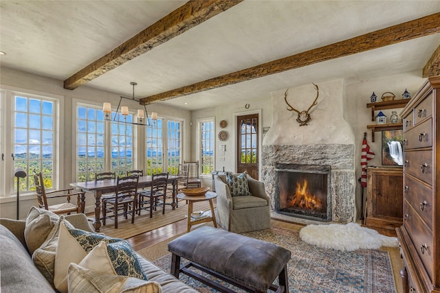 168 Old Wagon Rd, Highlands, NC 28741 - living area with wood finished floors, a premium fireplace, and beamed ceiling