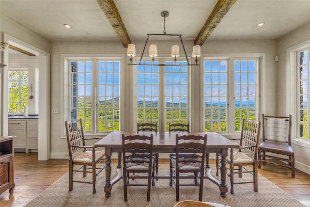 168 Old Wagon Rd, Highlands, NC 28741 - dining space with beamed ceiling, healthy amount of natural light, hardwood / wood-style floors, and baseboards