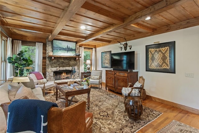 161 Kestrel Ct, Sapphire, NC 28774 - living room featuring a wooden ceiling with exposed beams, wood finished floors, and a fireplace